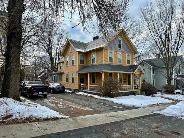a front view of a house with a yard