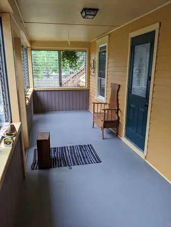 a balcony with furniture and a window