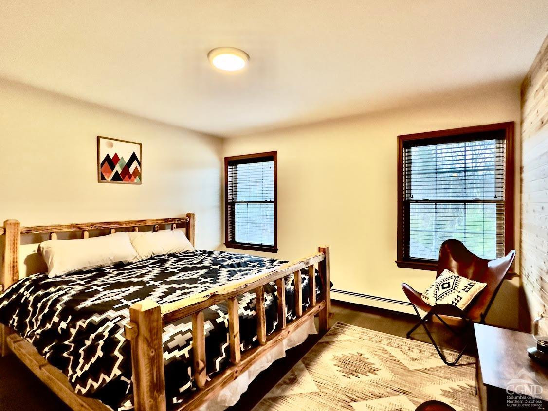 90 Cramer Road Jewett, NY 12444 - Photo 25 of 50 a bedroom with a bed and wooden floor