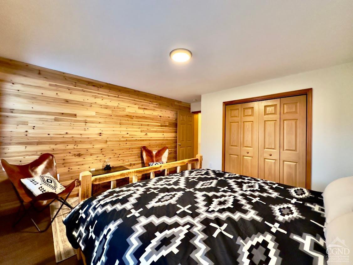 90 Cramer Road Jewett, NY 12444 - Photo 27 of 50 a bed sitting in a bedroom next to a window