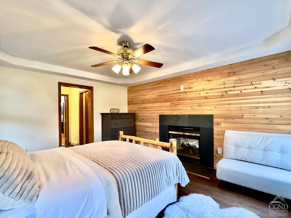 90 Cramer Road Jewett, NY 12444 - Photo 33 of 50 a spacious bedroom with a bed and a fireplace
