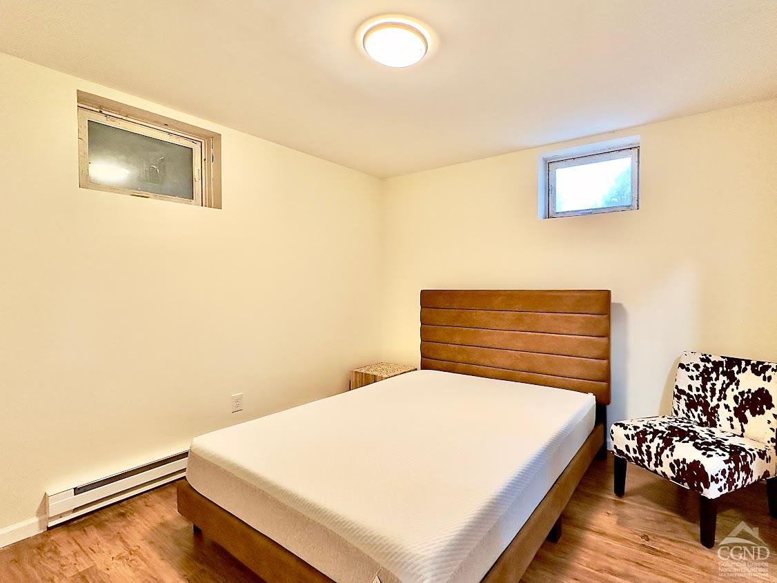 90 Cramer Road Jewett, NY 12444 - Photo 37 of 50 a bedroom with a bed and a window