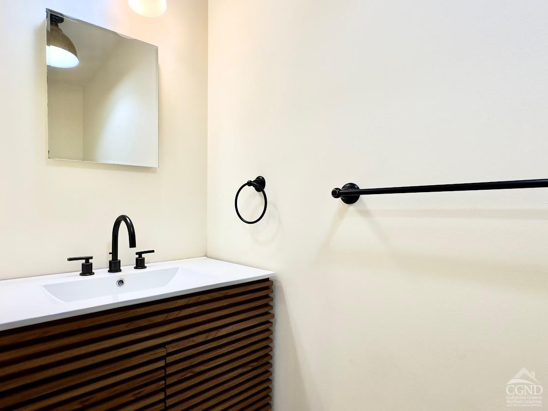 90 Cramer Road Jewett, NY 12444 - Photo 40 of 50 a bathroom with a sink and mirror