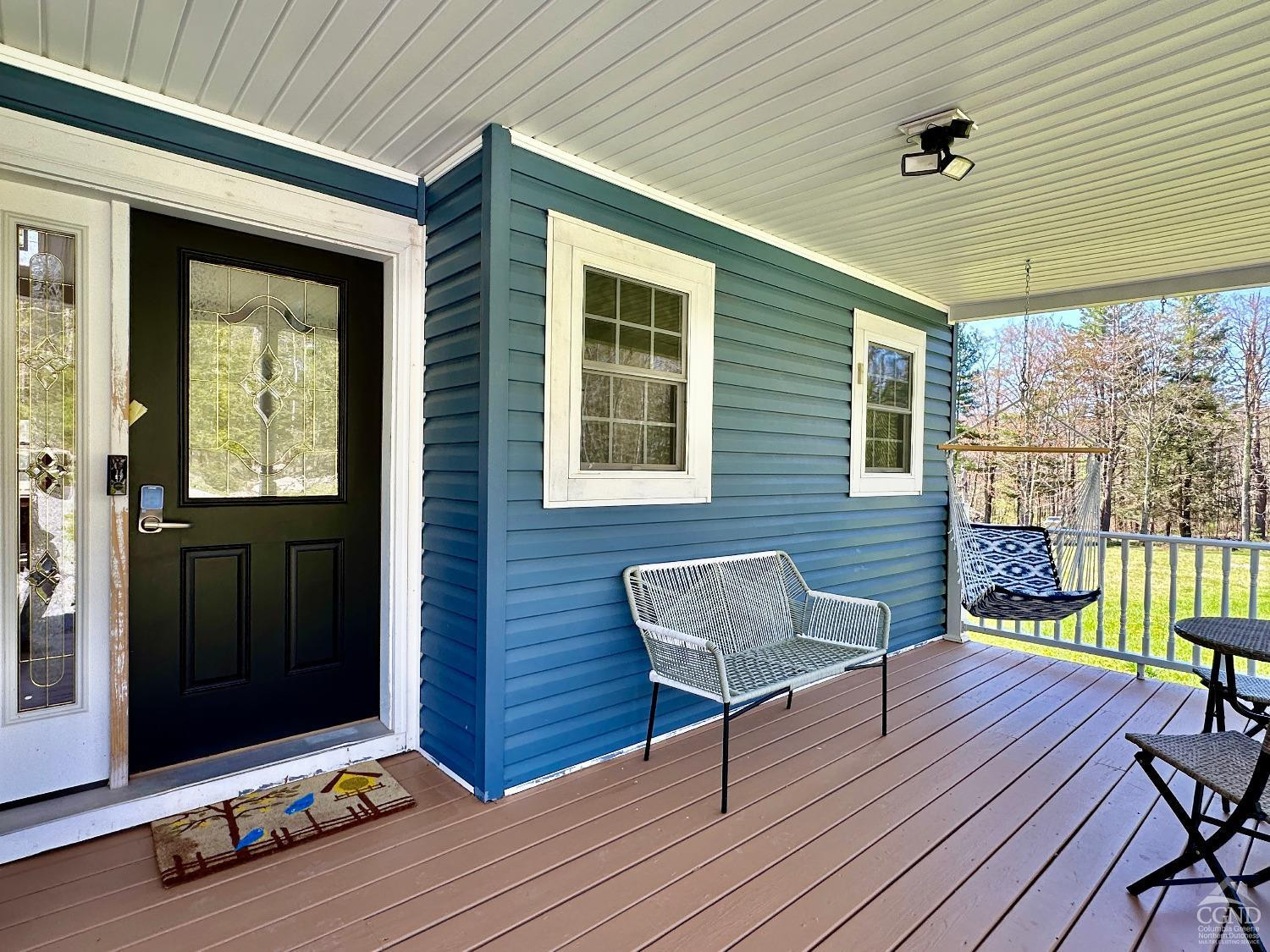 90 Cramer Road Jewett, NY 12444 - Photo 44 of 50 a balcony with furniture and wooden floor