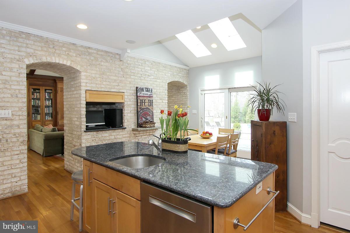 6904 Nevis Road Bethesda, MD 20817 - Photo 12 of 29 Kitchen opens to Eat-in Area w/sky lights