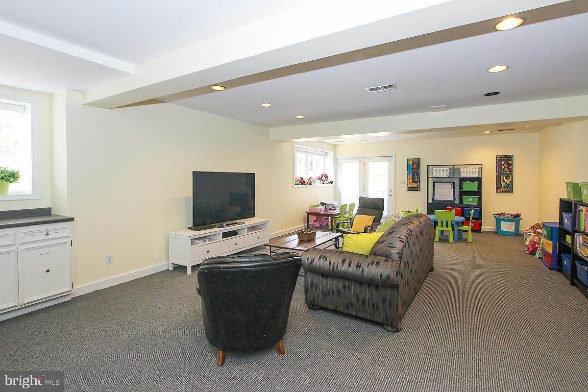 6904 Nevis Road Bethesda, MD 20817 - Photo 22 of 29 LARGE RecRm steps out to yard