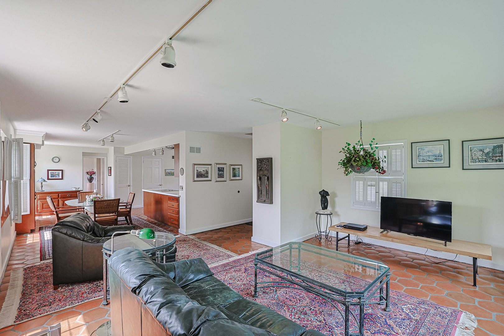 1596 West Palatine Road Inverness, IL 60067 - Photo 11 of 49 a living room with furniture a flat screen tv and a table