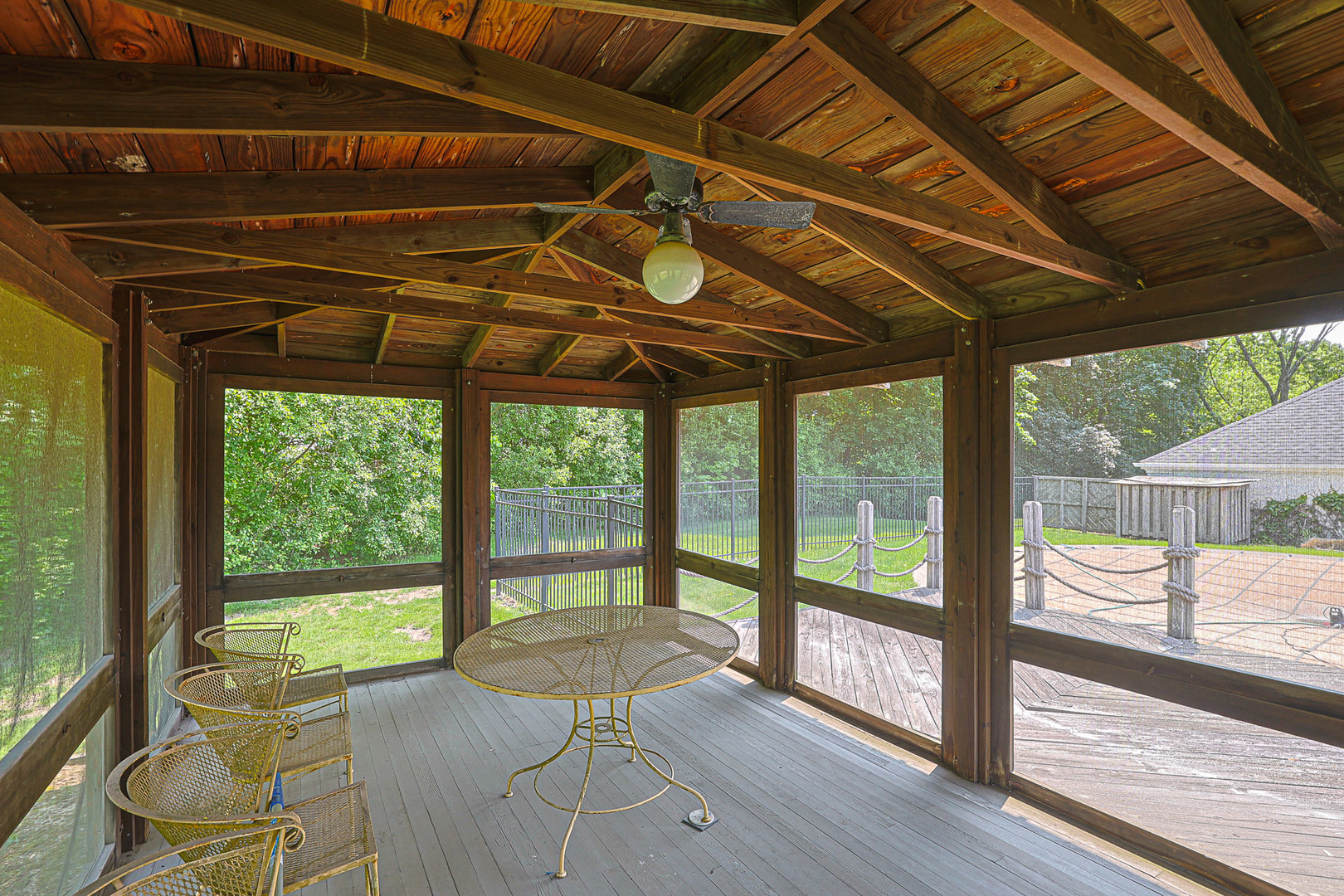 1596 West Palatine Road Inverness, IL 60067 - Photo 47 of 49 a view of a patio with table and chairs a barbeque with wooden floor and roof with a view of the back