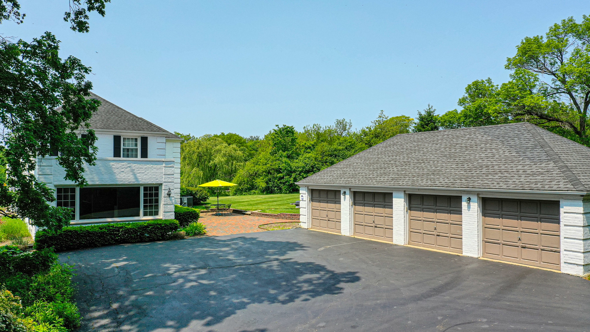 1596 West Palatine Road Inverness, IL 60067 - Photo 5 of 49 a front view of a house with a yard and garage