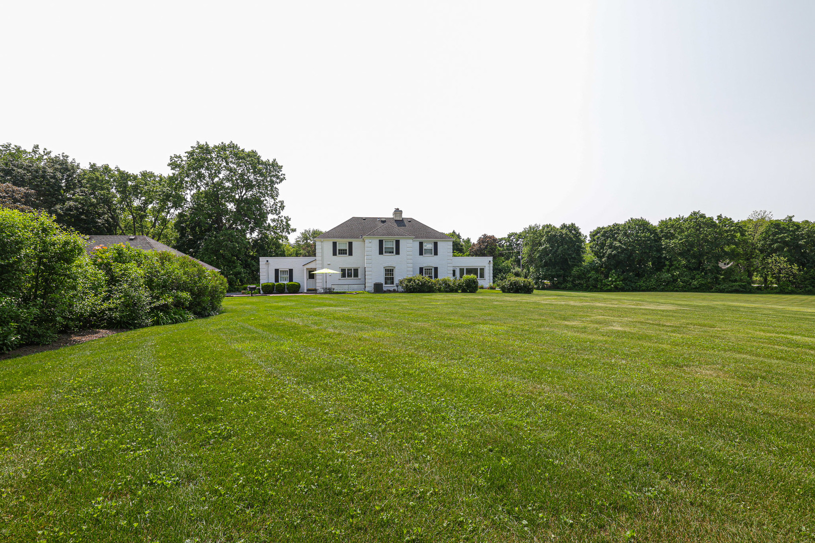 1596 West Palatine Road Inverness, IL 60067 - Photo 6 of 49 a house view with a garden space