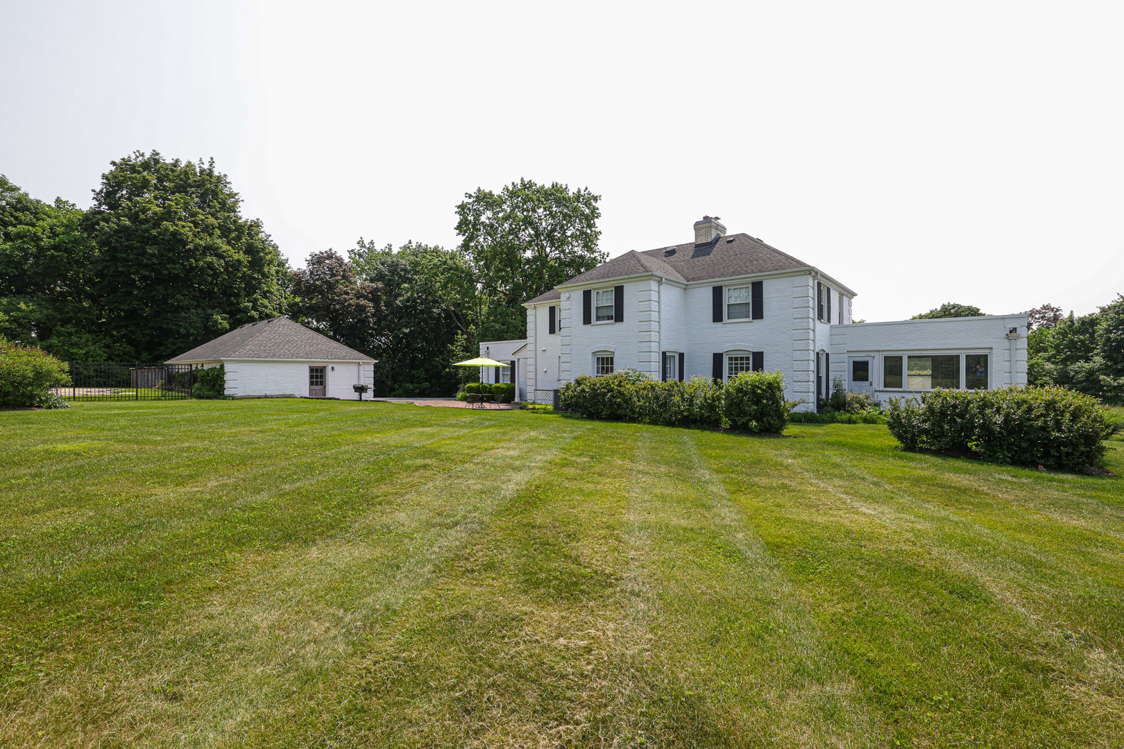 1596 West Palatine Road Inverness, IL 60067 - Photo 7 of 49 a front view of a house with yard and green space