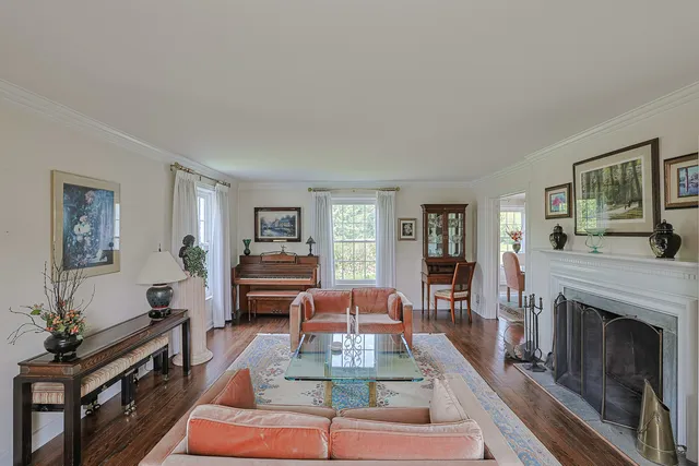 a living room with furniture fireplace and flat screen tv