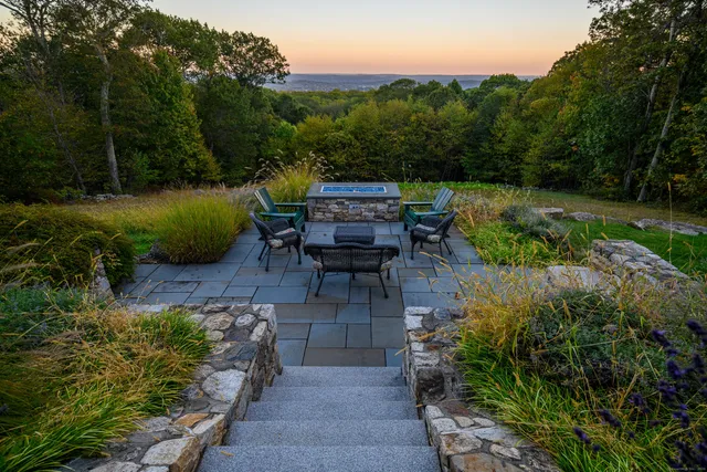 a garden view with a seating space