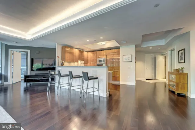 a bed sitting in a bedroom next to a large window