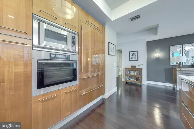 a balcony with furniture and a potted plant