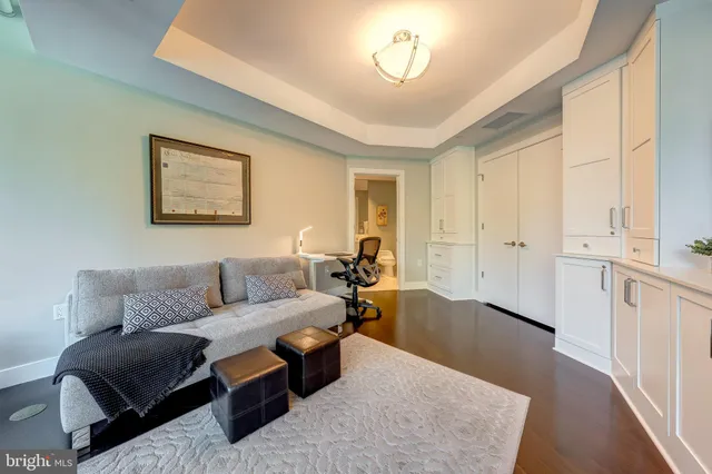 a balcony with furniture and a potted plant