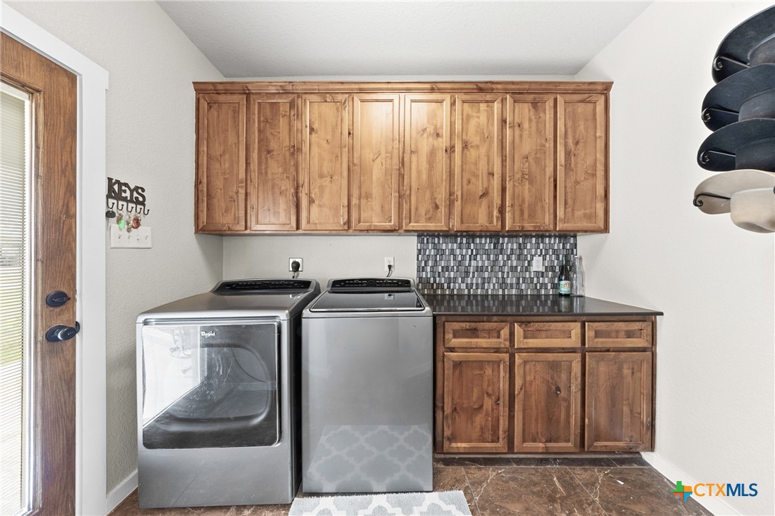 452 County Road 470 Chilton, TX 76632 - Photo 20 of 47 a kitchen with a stove and cabinets
