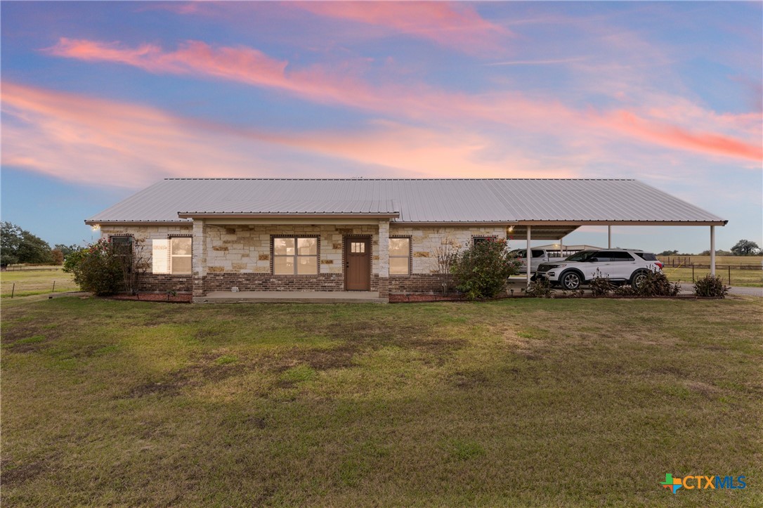 452 County Road 470 Chilton, TX 76632 - Photo 2 of 47 a front view of a house with a garden