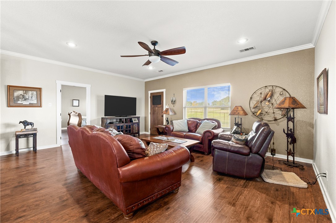 452 County Road 470 Chilton, TX 76632 - Photo 4 of 47 a living room with furniture a ceiling fan and a flat screen tv