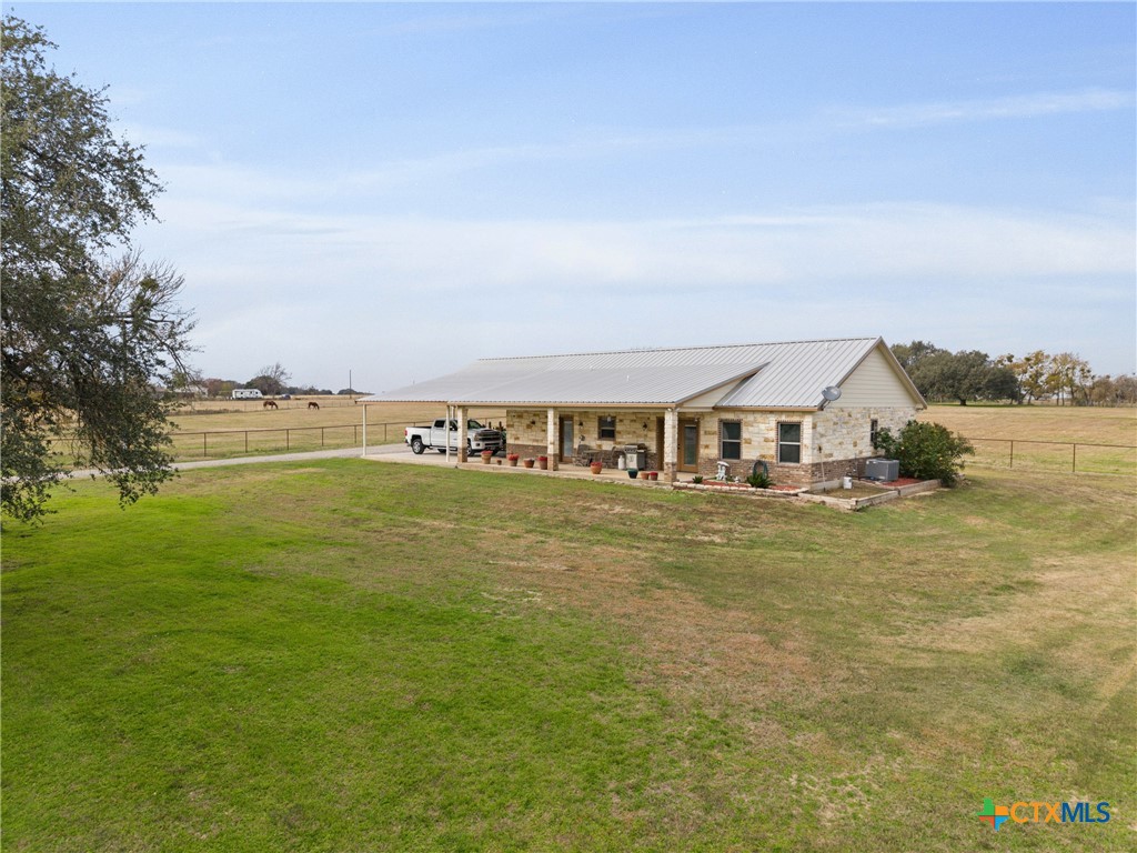 452 County Road 470 Chilton, TX 76632 - Photo 45 of 47 a view of a large pool with lawn chairs and large trees