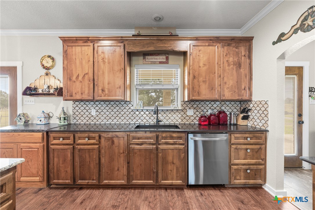 452 County Road 470 Chilton, TX 76632 - Photo 9 of 47 a kitchen with stainless steel appliances granite countertop a sink and cabinets