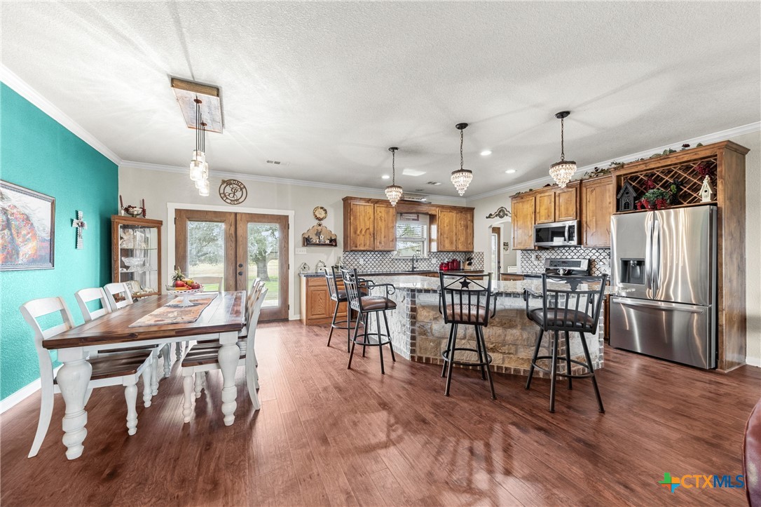 452 County Road 470 Chilton, TX 76632 - Photo 10 of 47 a view of a dining room with furniture window and wooden floor
