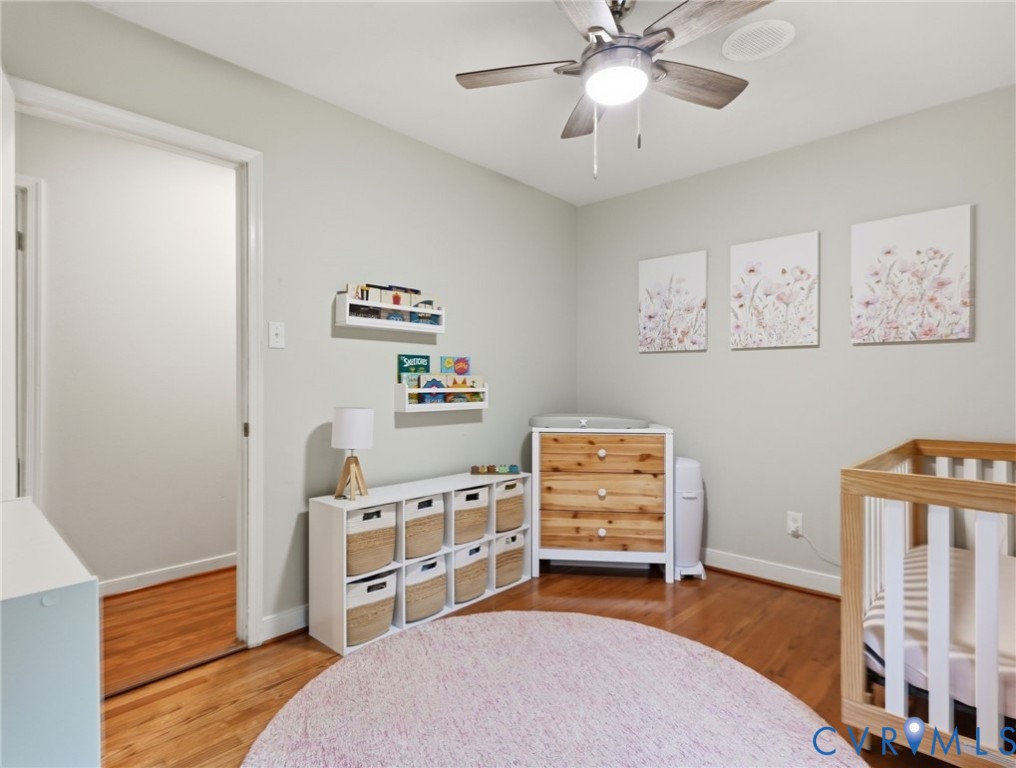 7707 Woodbrook Road Quinton, VA 23141 - Photo 21 of 42 Room featuring light-colored walls, wood-finish fl