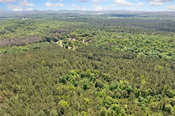 a view of a yard with an outdoor seating