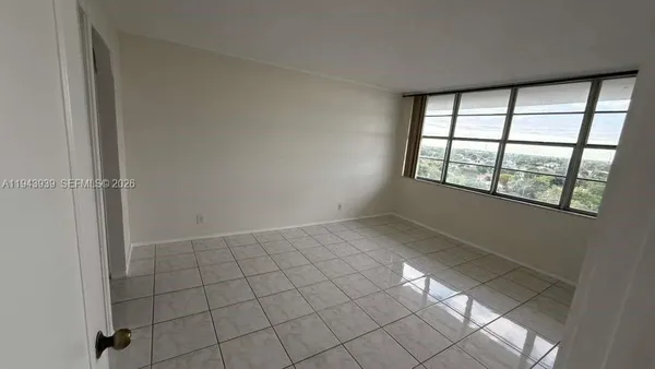 a view of an empty room and window