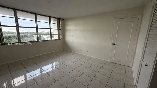 a view of an empty room and window