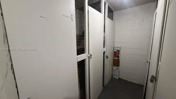 a bathroom with a shower and a glass door