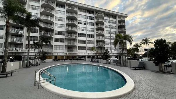 a view of a swimming pool with a patio