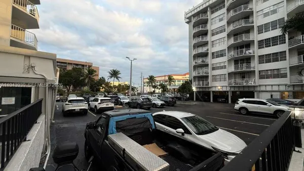 a view of a patio with swimming pool table and chairs
