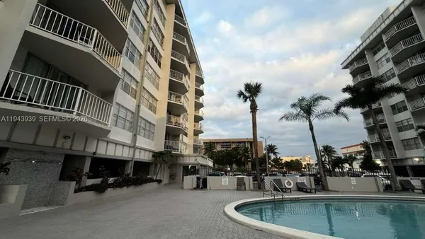 a view of a swimming pool with a lounge chairs