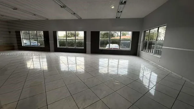 a view of a building with a floor to ceiling window and stairs
