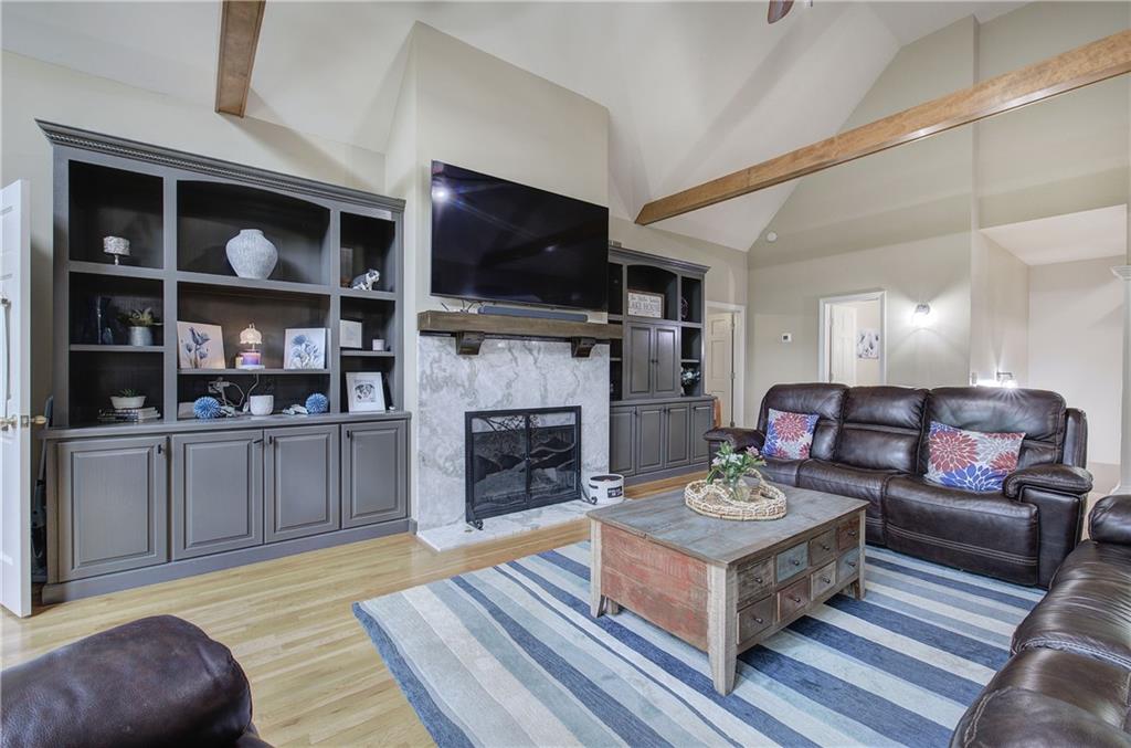 181 Fox Den Circle Jasper, GA 30143 - Photo 20 of 111 a living room with furniture a fireplace and a flat screen tv