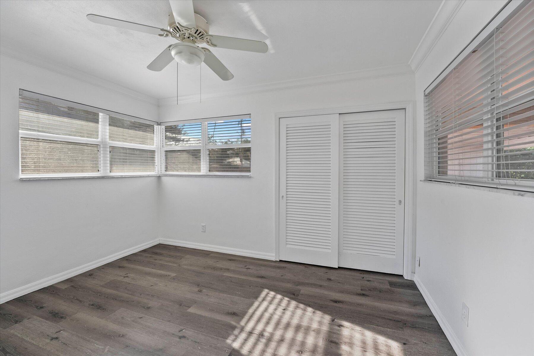 101 South Colorado Avenue Stuart, FL 34994 - Photo 11 of 17 an empty room with a windows and ceiling fan