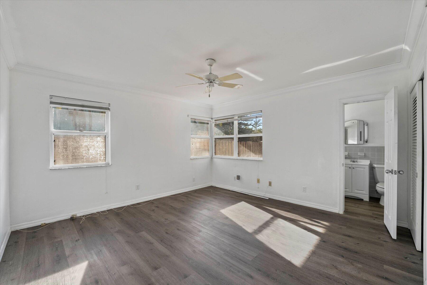 101 South Colorado Avenue Stuart, FL 34994 - Photo 13 of 17 wooden floor in an empty room with a window
