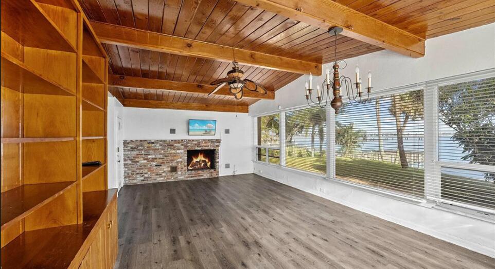 101 South Colorado Avenue Stuart, FL 34994 - Photo 8 of 17 a view of an empty room with wooden floor and a window