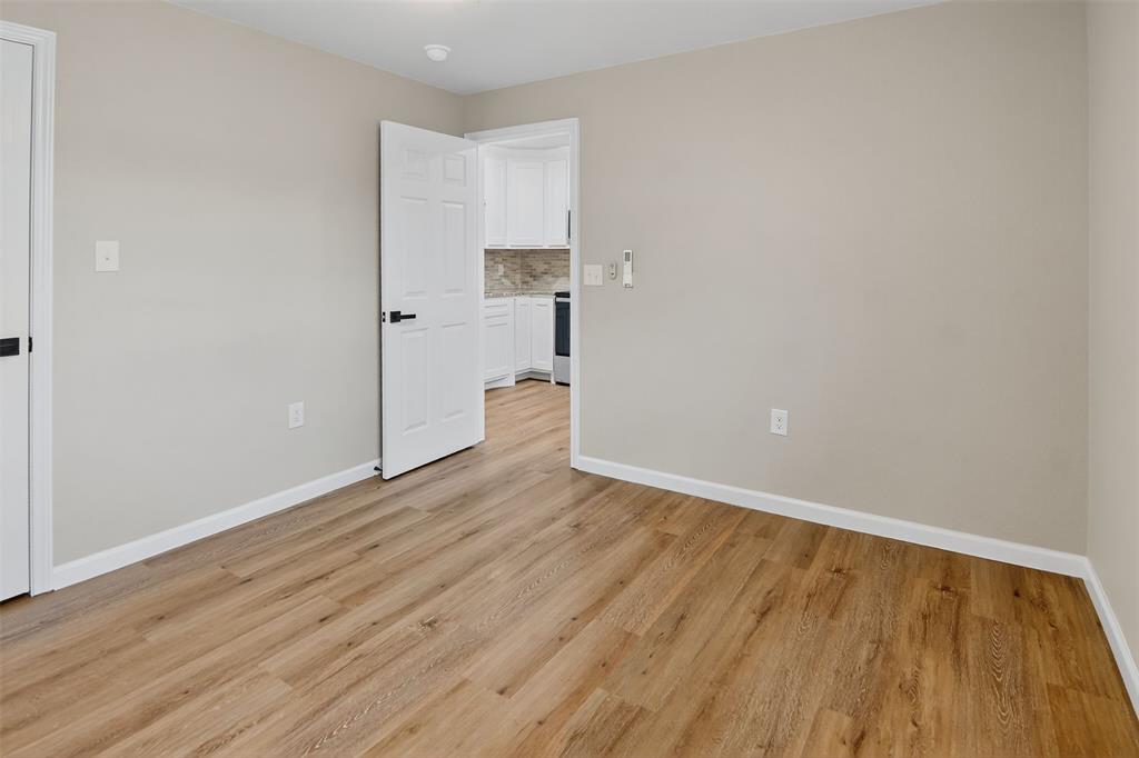 9256 Apt 300 S Fm 51 Boyd, TX 76023 - Photo 4 of 12 a view of empty room with wooden floor