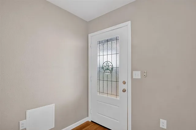 a view of entryway with wooden floor