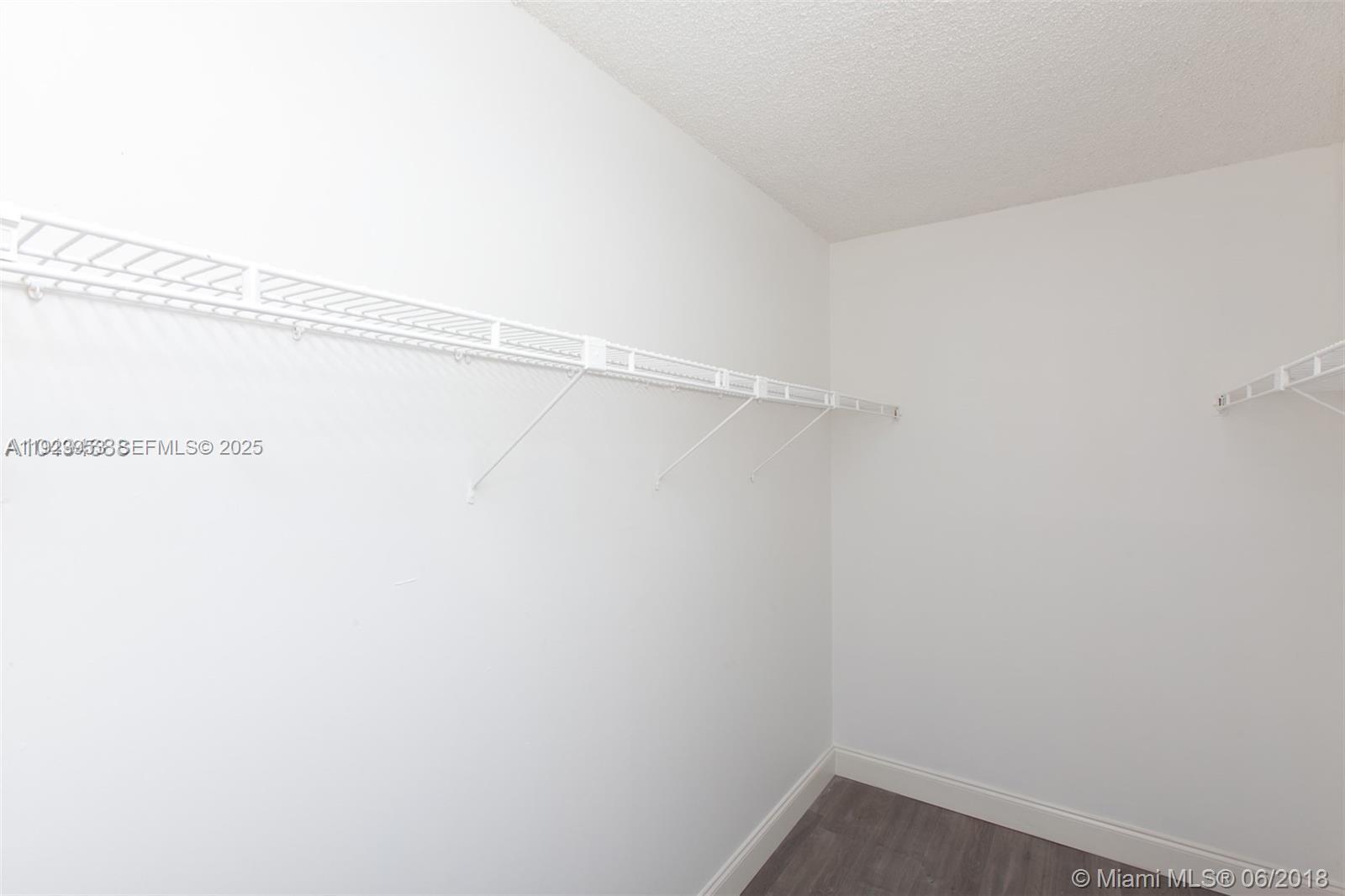 3821 Environ Boulevard, Unit 107 Lauderhill, FL 33319 - Photo 11 of 19 a view of a room with racks on the wall