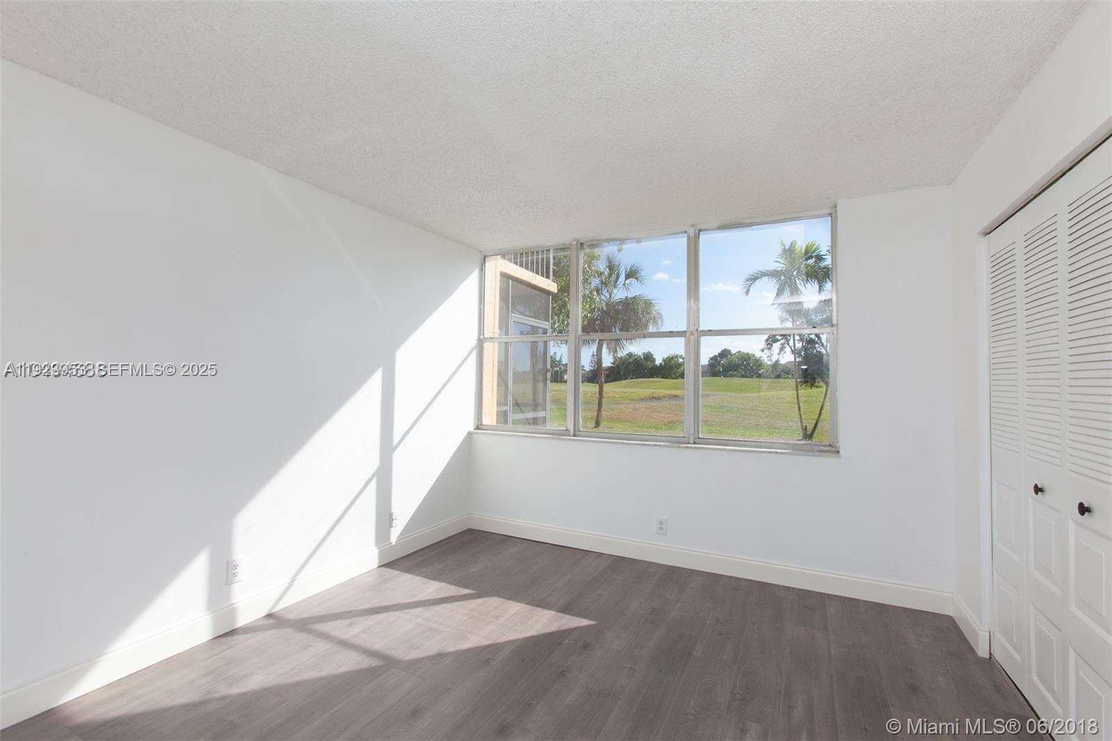3821 Environ Boulevard, Unit 107 Lauderhill, FL 33319 - Photo 10 of 19 a view of an empty room with a window