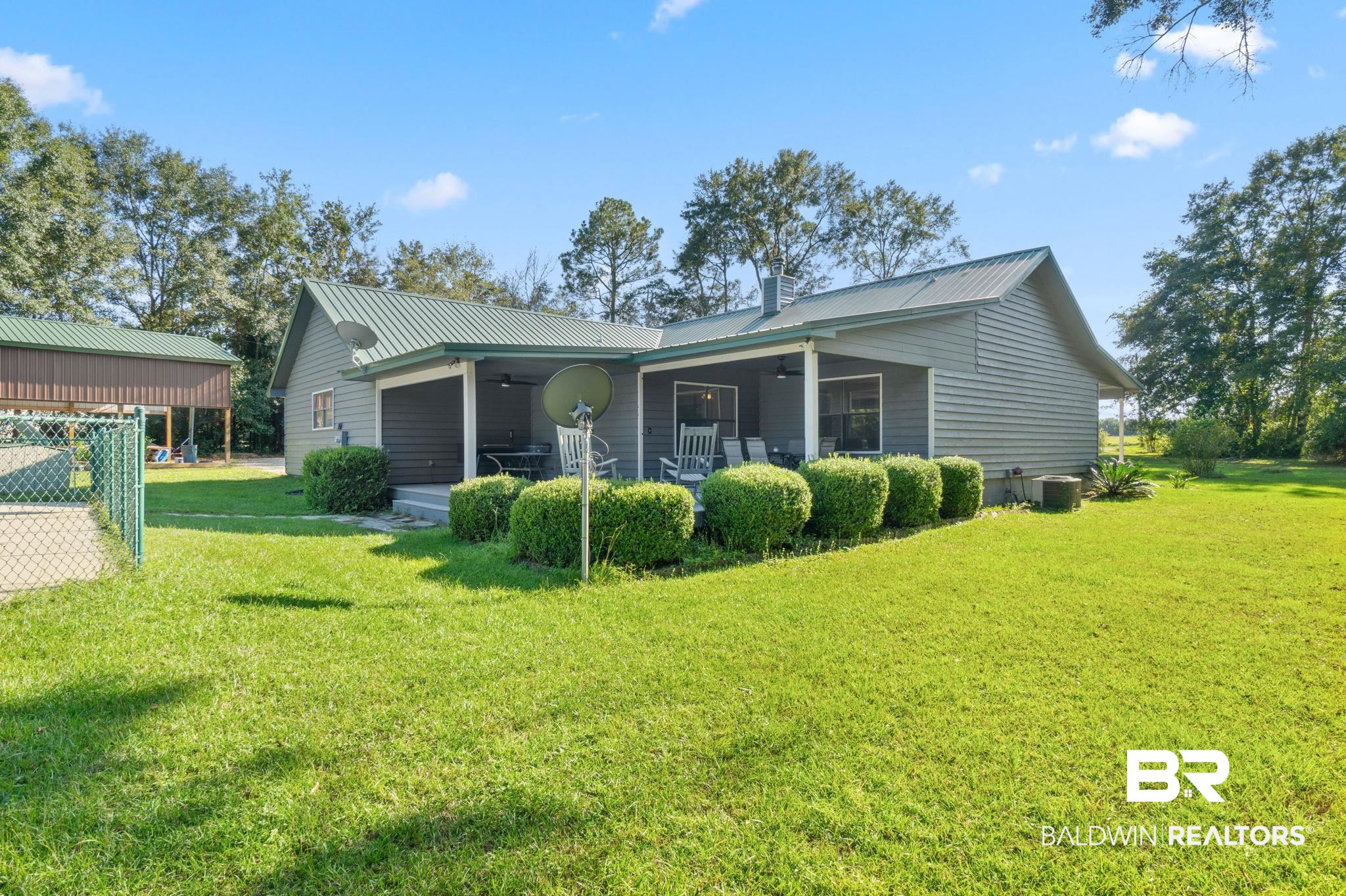 27300 C R Watson Road Robertsdale, AL 36567 - Photo 26 of 35 Rear view of house with a yard
