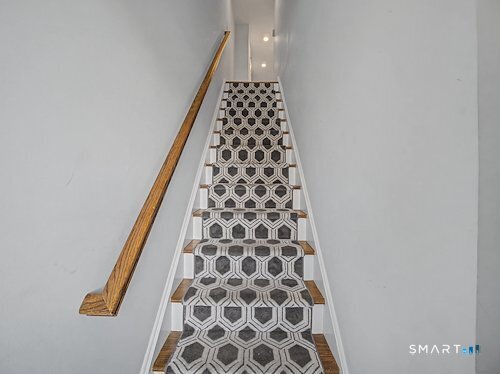 9 River Road, Unit 418 Greenwich, CT 06807 - Photo 20 of 38 a bathroom with a black and white checkered floor