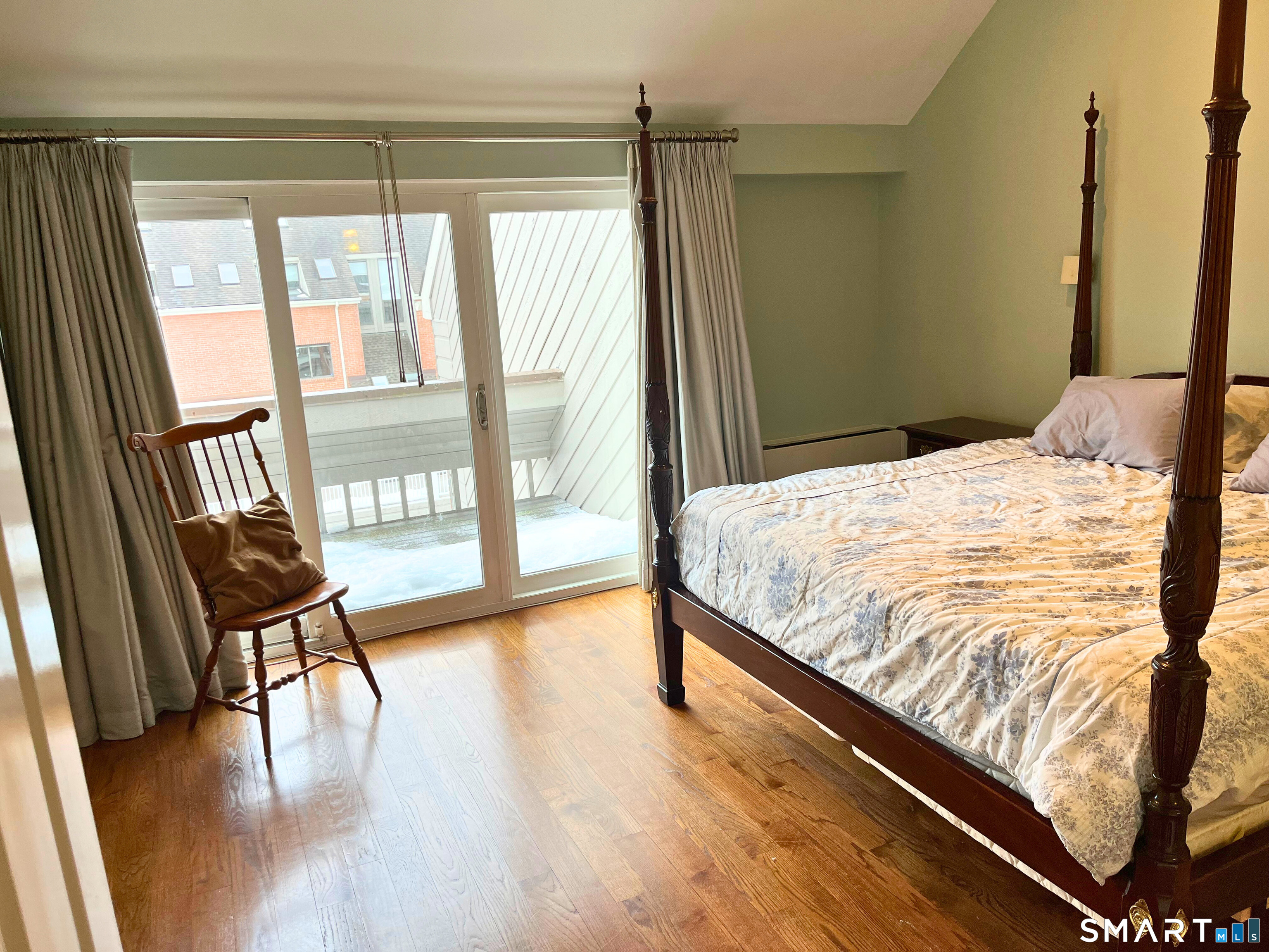 9 River Road, Unit 418 Greenwich, CT 06807 - Photo 23 of 38 a bedroom with a bed and a large window