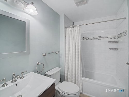 9 River Road, Unit 418 Greenwich, CT 06807 - Photo 30 of 38 a bathroom with a sink toilet and shower