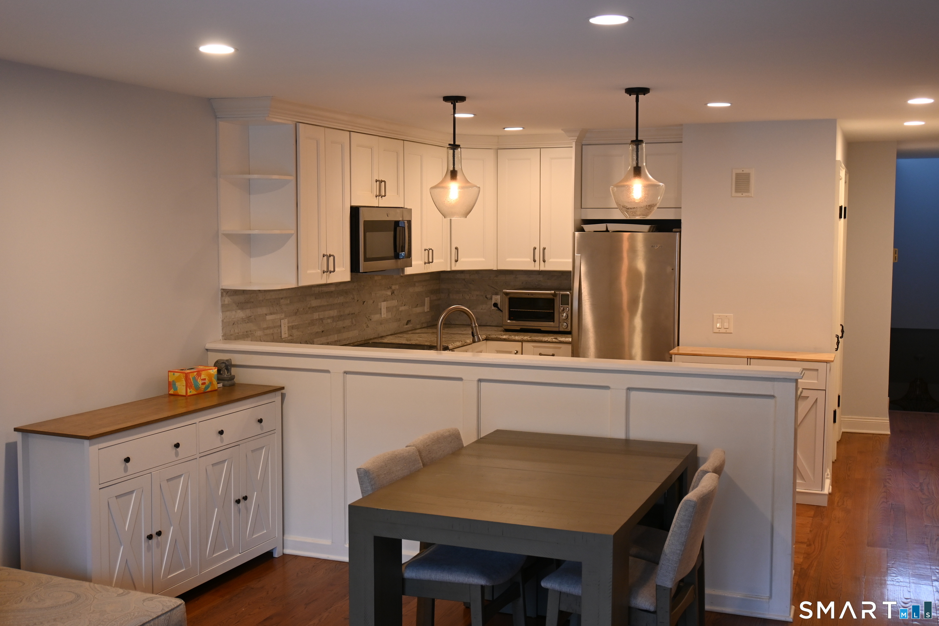 9 River Road, Unit 418 Greenwich, CT 06807 - Photo 3 of 38 a kitchen with a sink refrigerator and cabinets