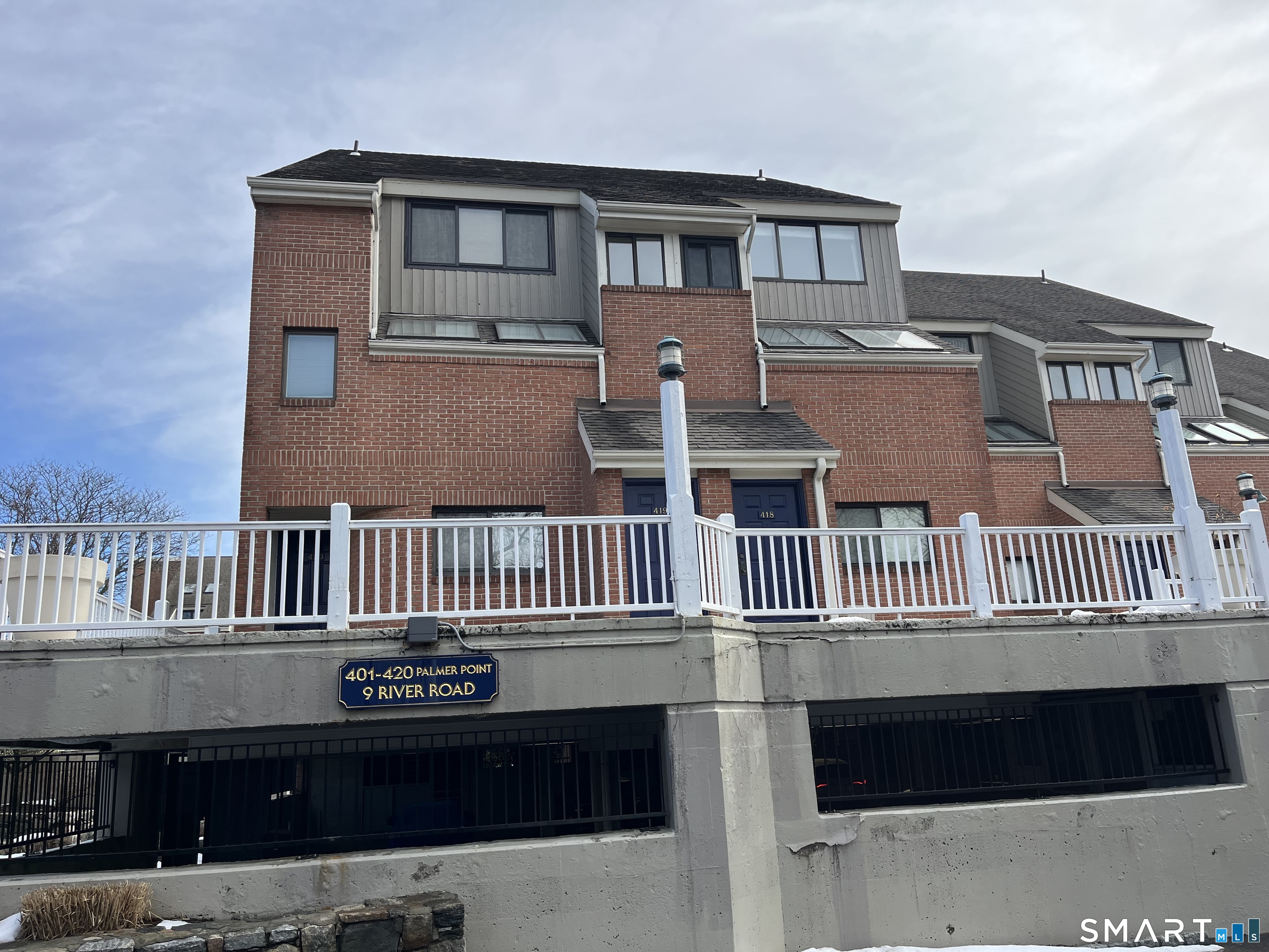 9 River Road, Unit 418 Greenwich, CT 06807 - Photo 35 of 38 a front view of a house with a balcony