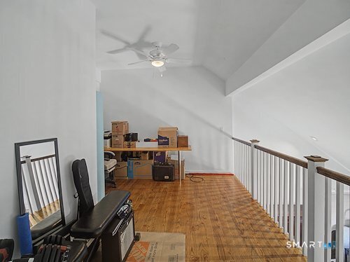 9 River Road, Unit 418 Greenwich, CT 06807 - Photo 36 of 38 a view of a workspace with furniture and a chandelier